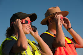 people using solar viewing glasses